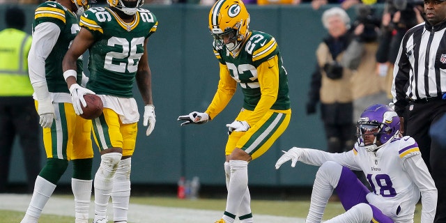 January 1, 2023;  Green Bay, Wisconsin, United States;  Green Bay Packers cornerback Jaire Alexander does the griddy after breaking up a pass intended for Minnesota Vikings wide receiver Justin Jefferson (18) at Lambeau Field.