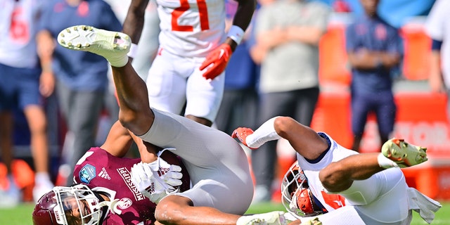 Justin Robinson #18 of the Mississippi State Bulldogs make a 12-yard reception for a first down in the first quarter against the Illinois Fighting Illini during the ReliaQuest Bowl at Raymond James Stadium on January 02, 2023 in Tampa, Florida.