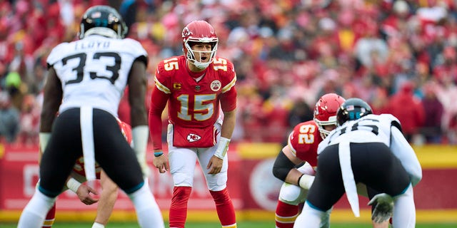 Patrick Mahomes #15 of the Kansas City Chiefs calls a play at the line of scrimmage against the Jacksonville Jaguars during the first half at GEHA Field at Arrowhead Stadium on January 21, 2023 in Kansas City, Missouri.