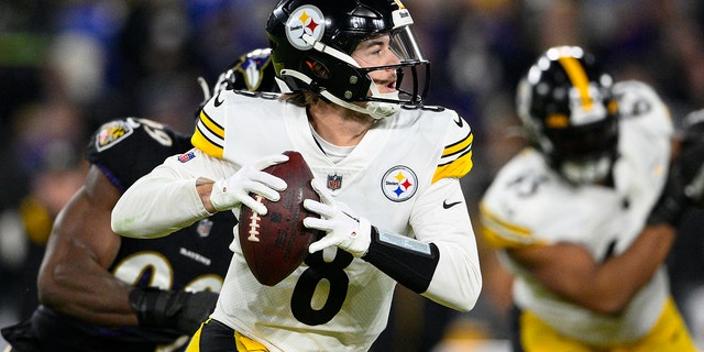 Pittsburgh Steelers quarterback Kenny Pickett (8) throws against the Baltimore Ravens in the first half of an NFL football game in Baltimore, Sunday, Jan. 1, 2023. 