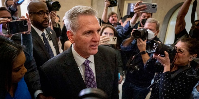 The press corps surrounds House Minority Leader Kevin McCarthy.