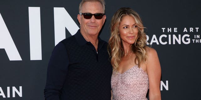 Kevin Costner and his wife Christine Baumgartner at film premiere