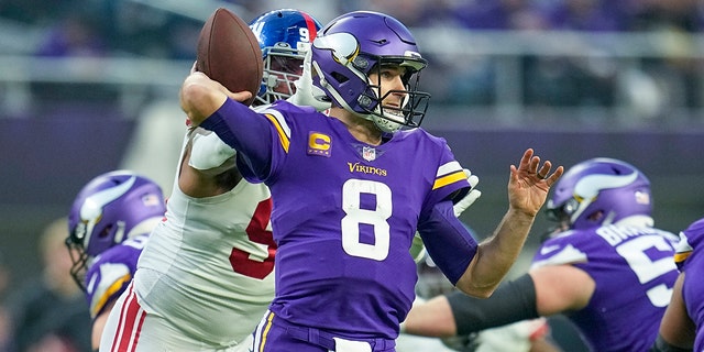 Minnesota Vikings' Kirk Cousins ​​throws during the first half of an NFL Wild Card football game against the New York Giants, Sunday, Jan. 15, 2023, in Minneapolis. 