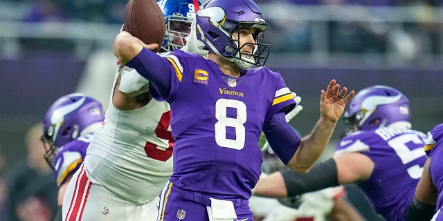 Minnesota Vikings' Kirk Cousins throws during the first half of an NFL Wild Card football game against the New York Giants, Sunday, Jan. 15, 2023, in Minneapolis.