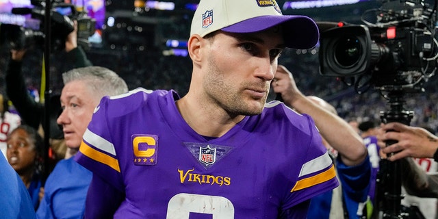 Minnesota Vikings quarterback Kirk Cousins walks off the field after an NFL wild card game against the New York Giants in Minneapolis on Jan. 15, 2023.