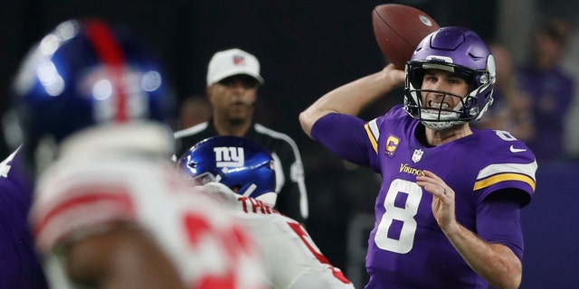 Minnesota Vikings' Kirk Cousins throws in the wild-card game against the New York Giants, Sunday, Jan. 15, 2023, in Minneapolis.