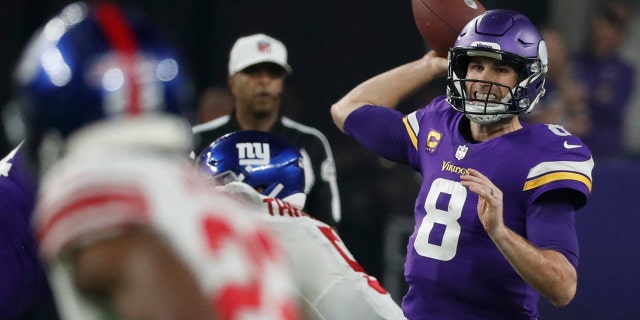 Minnesota Vikings' Kirk Cousins throws in the wild-card game against the New York Giants, Sunday, Jan. 15, 2023, in Minneapolis.