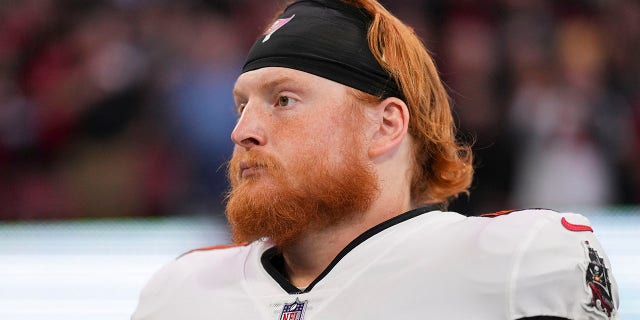 Ko Kieft #41 of the Tampa Bay Buccaneers stands during the national anthem against the Atlanta Falcons at Mercedes-Benz Stadium on January 8, 2023 in Atlanta, Georgia.