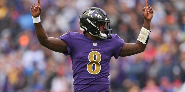 Quarterback Lamar Jackson #8 of the Baltimore Ravens celebrates after teammate J.K. Dobbins #27 scored a touchdown in the first quarter against the Buffalo Bills at M&T Bank Stadium on October 02, 2022 in Baltimore, Maryland.
