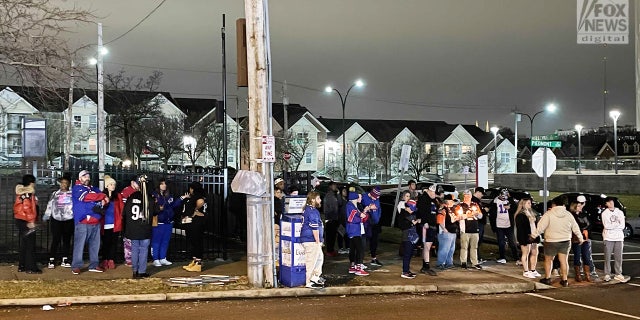 Fans gather outside University of Cincinnati Medical Center and pray for 24-year-old Buffalo Bills player Damar Hamlin. 