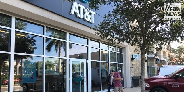 Christopher and Roberta Laundrie leave a Florida AT&amp;T store on Oct. 19, 2021.
