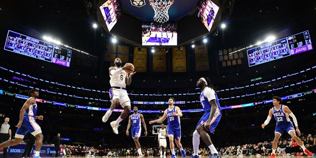 LeBron James #6 of the Los Angeles Lakers drives to the basket during the game against the Philadelphia 76ers on January 15, 2023 at Crypto.Com Arena in Los Angeles, California.