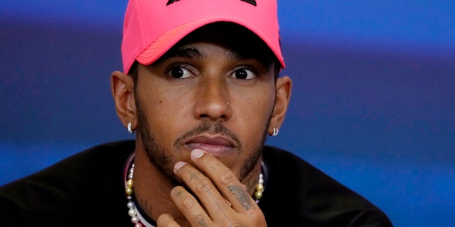 Lewis Hamilton of Great Britain and Mercedes react at a news conference during previews ahead of the Abu Dhabi F1 Grand Prix at Yas Marina Circuit in Abu Dhabi, United Arab Emirates on November 17, 2022. 