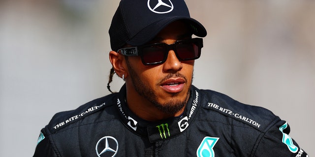 Lewis Hamilton of Great Britain and Mercedes look on before the F1 2022 year-end photo before the Abu Dhabi F1 Grand Prix at Yas Marina Circuit on November 20, 2022 in Abu Dhabi, United Arab Emirates.