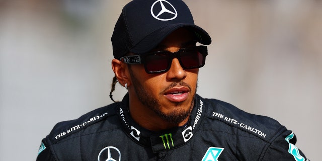 Lewis Hamilton of Great Britain and Mercedes look on before the F1 2022 year-end photo before the Abu Dhabi F1 Grand Prix at Yas Marina Circuit on November 20, 2022 in Abu Dhabi, United Arab Emirates.