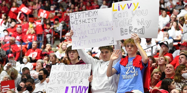 Fans hold signs for LSU's Olivia Dunne during a PAC-12 game against Utah at the Jon M. Huntsman Center on January 6, 2023, in Salt Lake City, Utah.