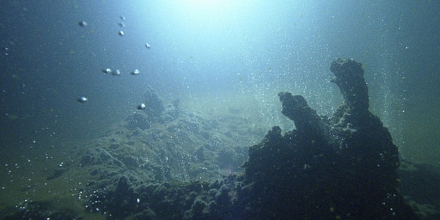 Submarine volcanic activity along a section of the Kolumbo crater on the seafloor, observed with SANTORY monitoring equipment.