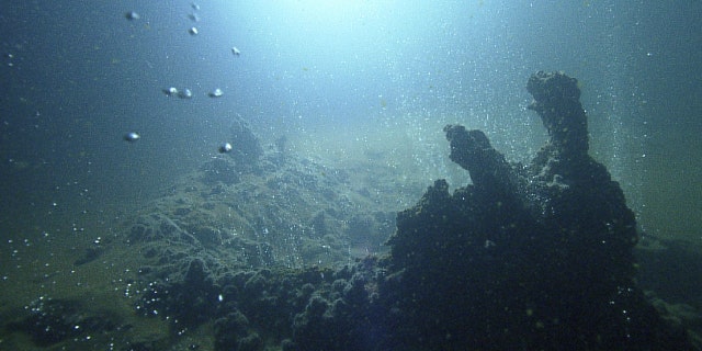 Submarine volcanic activity along a section of the Kolumbo crater on the seafloor, observed with SANTORY monitoring equipment.