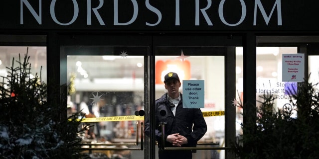 An officer stands inside Nordstrom at Mall of America