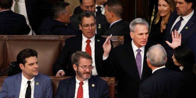 House Republican Leader Kevin McCarthy, R-Calif., talks members-elect as Rep.-elect Matt Gaetz, R-Fla., and Rep.-elect Tim Burchett, R-Tenn., watch in the House Chamber during the second day of elections for Speaker of the House at the US Capitol Building on Jan. 4, 2023, in Washington, DC 