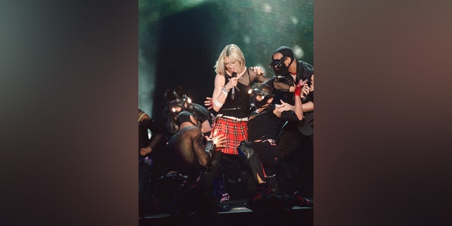 Pop star Madonna performs on stage during a concert on June 26, 2001, in Paris, France.