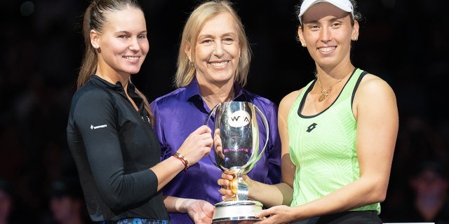 Martina Navratilova, center, poses with Elise Mertens, right, and Veronika Kudermetova after winning the doubles final against Barbora Krejcikova and Katerina Siniakova at the WTA Finals at Dickies Arena on November 7, 2022 in Forth Worth, Texas. 