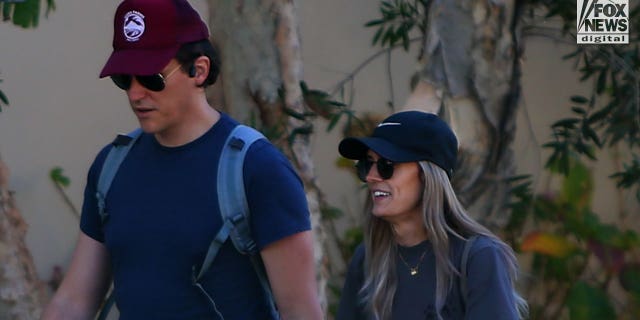 Matt Hutchins takes an energetic walk with a female friend in Los Angeles on Saturday, January 21, 2023. Hutchins is the widow of Halyna Hutchins who was shot dead on the set of Rust, for which actor, Alec Baldwin has been charged with involuntary manslaughter.