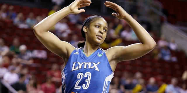 Maya Moore of the Minnesota Lynx in action against the Seattle Storm in the first half of a WNBA basketball game on September 10, 2013, in Seattle.