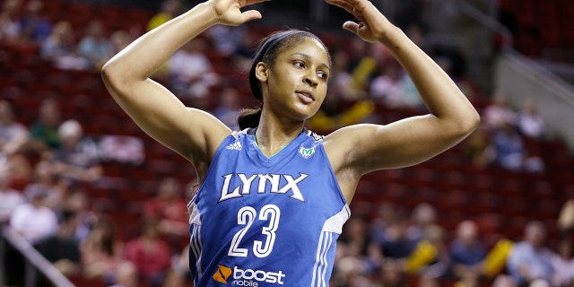 Maya Moore of the Minnesota Lynx in action against the Seattle Storm in the first half of a WNBA basketball game on September 10, 2013, in Seattle.