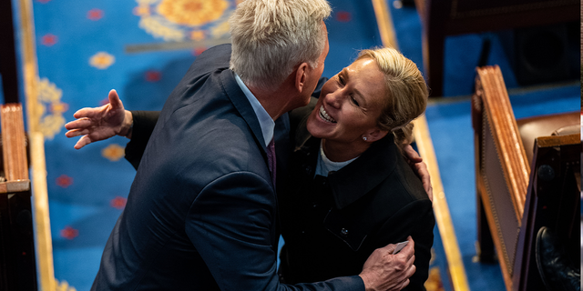 Rep. Kevin McCarthy (R-CA) hugs Rep. Marjorie Taylor Greene (R-GA) on the floor of the House Chamber of the U.S. Capitol Building on Friday, Jan. 6, 2023 in Washington, DC.