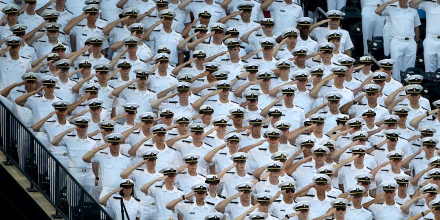 Sailors from the Merchant Marine Academy salute during the national anthem before the Arizona Diamondbacks-New York Mets game at Citi Field on Aug. 23, 2017, in New York City.