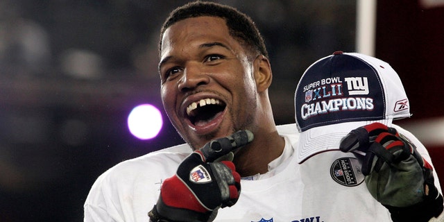 New York Giants defensive end Michael Strahan celebrates after his team's win over the New England Patriots in the NFL's Super Bowl XLII football game in Glendale, Arizona, Feb. 3, 2008.