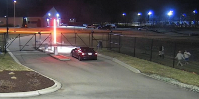 Three other inmates are seen making their way toward the stolen vehicle in Farmington, Missouri.