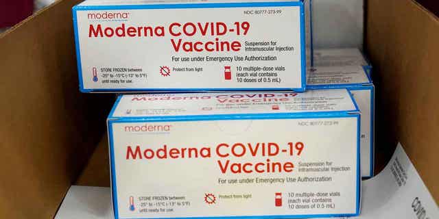 Boxes containing the Moderna COVID-19 vaccine are prepared to be shipped at the McKesson distribution center in Olive Branch, Mississippi, on Dec. 20, 2020. 