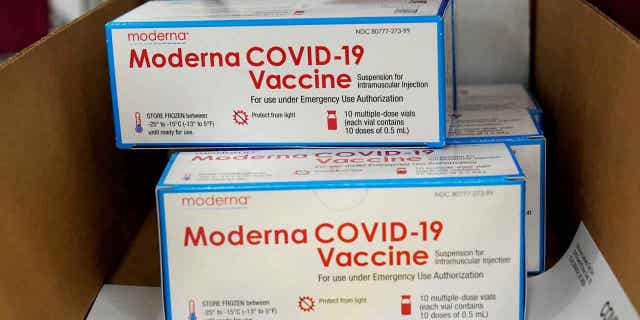 Boxes containing the Moderna COVID-19 vaccine are prepared to be shipped at the McKesson distribution center in Olive Branch, Mississippi, on Dec. 20, 2020. 