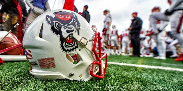 A North Carolina State helmet rests on the ground during the Notre Dame game on Oct. 28, 2017, in South Bend, Indiana.