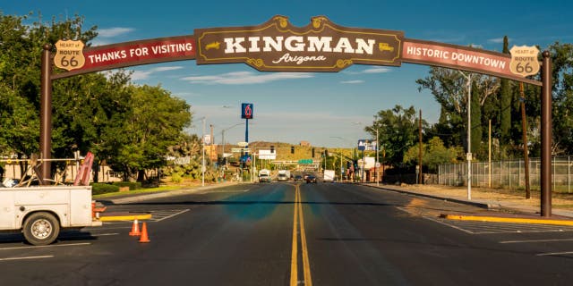 Historic Kingman, Arizona road sign over entrance of town.
