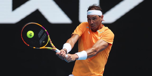 Rafael Nadal of Spain plays a backhand in their round one singles match against Jack Draper of Great Britain during day one of the 2023 Australian Open at Melbourne Park on January 16, 2023, in Melbourne, Australia.
