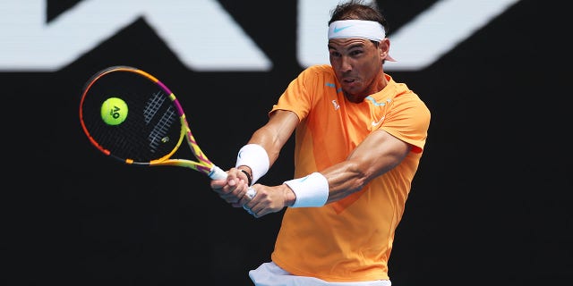 Rafael Nadal of Spain plays a backhand in his first round singles match against Jack Draper of Great Britain during day one of the 2023 Australian Open at Melbourne Park on January 16, 2023, in Melbourne, Australia.