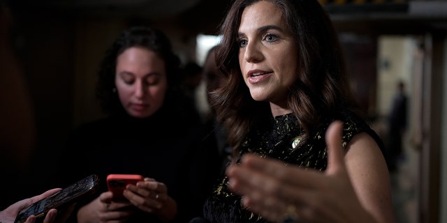 Nancy Mace talks to reporters