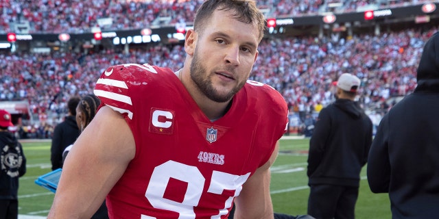 Nick Bosa #97 of the San Francisco 49ers on the sideline during the NFC Divisional playoff game against the Dallas Cowboys at Levi's Stadium on January 22, 2023 in Santa Clara, California.