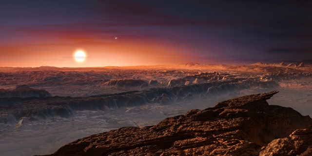 Een zicht op het oppervlak van de planeet Proxima b in een baan om de rode dwergster Proxima Centauri, de ster die het dichtst bij ons zonnestelsel staat, gezien in een ongedateerde artist's impression gepubliceerd door de European Southern Observatory op 24 augustus 2016. 