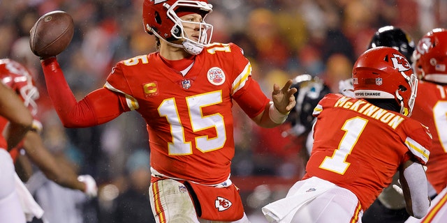 Patrick Mahomes #15 of the Kansas City Chiefs aims to advance against the Jacksonville Jaguars during the fourth quarter of the AFC Divisional Playoff game at Arrowhead Stadium on January 21, 2023 in Kansas City, Missouri.
