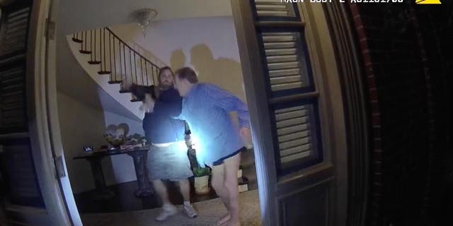 Body cam footage shows two men struggling