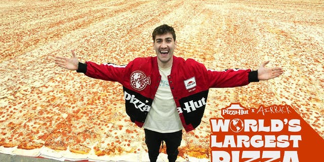 Eric "Airrack" Decker join Pizza Hut on its world's largest pizza attempt to celebrate his YouTube channel's 10 million subscribers.