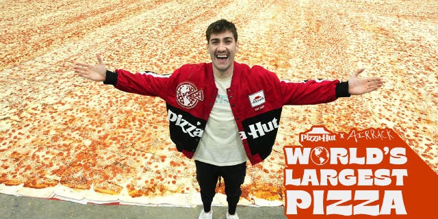 Eric "Airrack" Decker join Pizza Hut on its world's largest pizza attempt to celebrate his YouTube channel's 10 million subscribers.