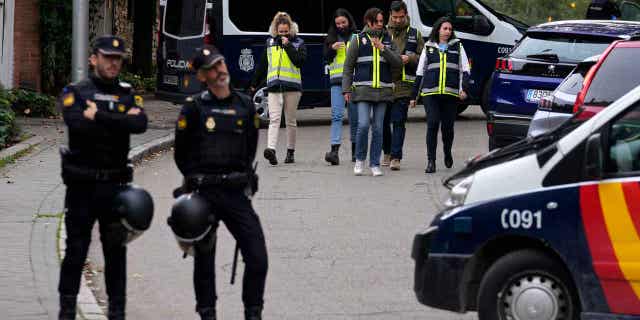 Police officers stand guard next to the Ukrainian embassy in Madrid, Spain, on Nov. 30, 2022. Spain’s National Court said on Jan. 27, 2023, it had charged a retired man with terrorism after he allegedly sent letters containing explosive material to multiple government officials, including the Ukrainian embassy in Spain.