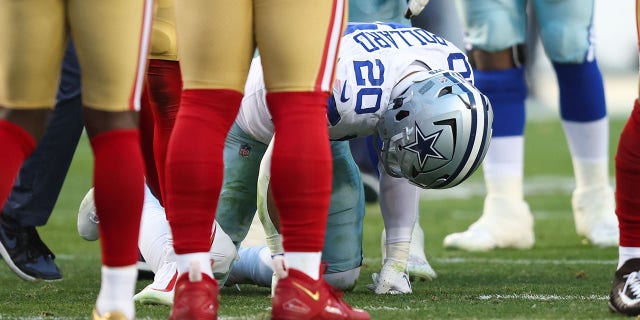 Tony Pollard of the Dallas Cowboys reacts after suffering an injury against the San Francisco 49ers at Levi's Stadium on January 22, 2023, in Santa Clara, California.