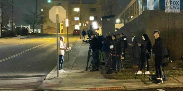 Members of the press wait outside the University of Cincinnati Medical Center as they await an update on injured player Damar Hamlin.