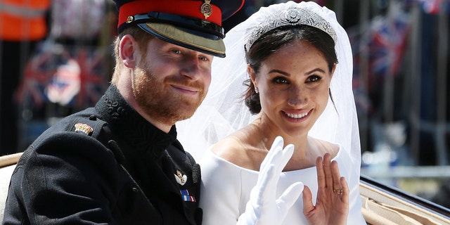 Prince Harry and Meghan Markle wave from the Ascot Landau Carriage during star-studded wedding in 2018 after their wedding ceremony. 